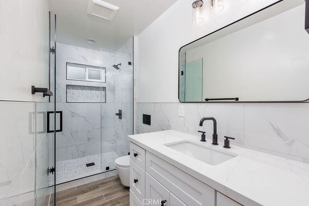 Bathroom, Glass Shower, Interior, Marble Walls, Wood Texture Flooring