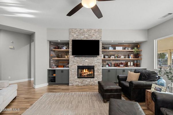 Fireplace, Interior, Living room, Recessed Lighting, Stone Walls, Wood Texture Flooring