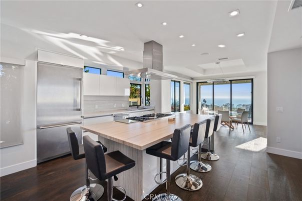 Dining room, Interior, Kitchen, Pendant Lights, Recessed Lighting, Stainless Steel Appliances, Water, Wood Texture Flooring