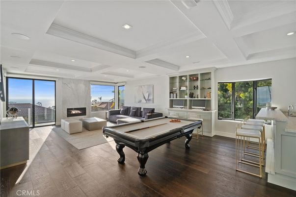 Billiard Table, Fireplace, Game Room, Interior, Living room, Recessed Lighting, Wood Texture Flooring