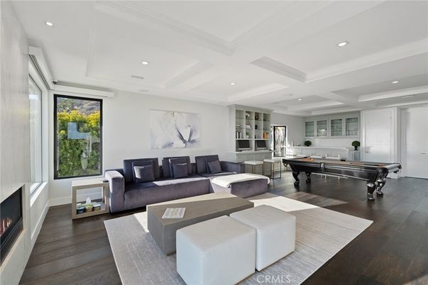 Billiard Table, Fireplace, Game Room, Interior, Living room, Recessed Lighting, Wood Texture Flooring