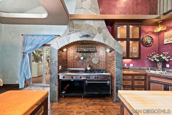 Fireplace, Interior, Kitchen, Stainless Steel Appliances, Stone Walls, Wood Texture Flooring