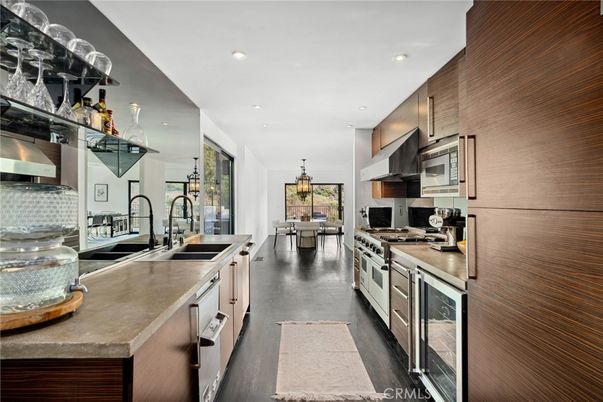 Chandelier, Dining room, Interior, Kitchen, Pendant Lights, Recessed Lighting, Stainless Steel Appliances, Wood Texture Flooring