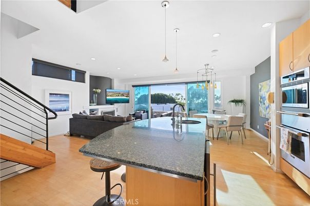 Dining room, Interior, Kitchen, Living room, Pendant Lights, Recessed Lighting, Stainless Steel Appliances, Water, Wood Texture Flooring