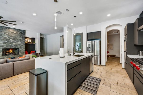 Fireplace, Interior, Kitchen, Living room, Pendant Lights, Recessed Lighting, Stainless Steel Appliances, Stone Walls