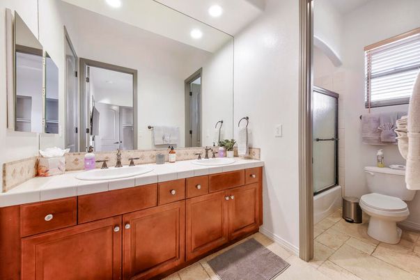 Bathroom, Dual Sink Vanities, Interior, Recessed Lighting, Tile Countertops