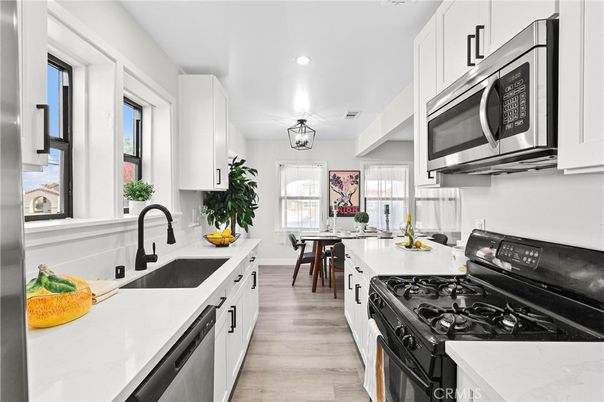 Dining room, Interior, Kitchen, Recessed Lighting, Stainless Steel Appliances, Wood Texture Flooring