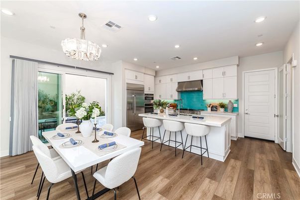 Chandelier, Dining room, Interior, Kitchen, Recessed Lighting, Stainless Steel Appliances, Wood Texture Flooring