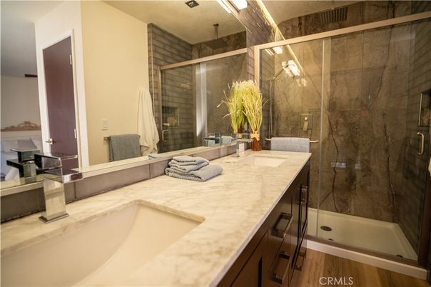 Bathroom, Dual Sink Vanities, Glass Shower, Interior, Wood Texture Flooring
