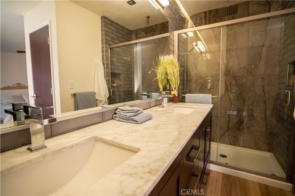 Bathroom, Dual Sink Vanities, Glass Shower, Interior, Wood Texture Flooring