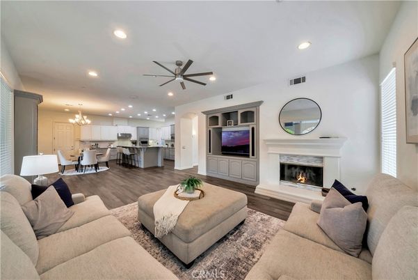 Dining room, Fireplace, Interior, Kitchen, Living room, Pendant Lights, Recessed Lighting, Stainless Steel Appliances, Wood Texture Flooring
