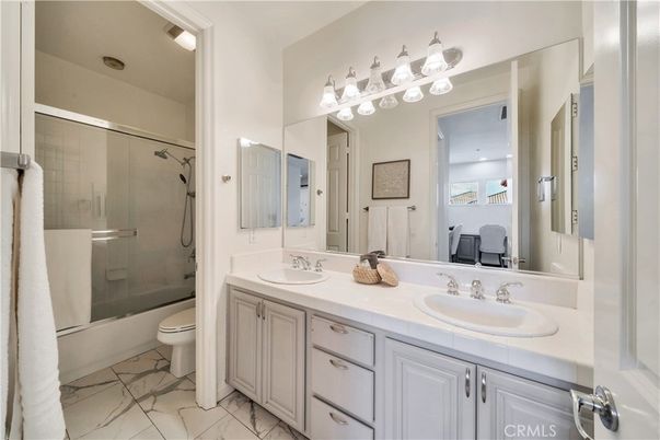 Bathroom, Dual Sink Vanities, Glass Shower, Interior, Marble, Recessed Lighting, Tile Countertops