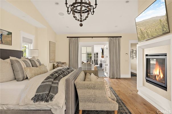 Bedroom, Chandelier, Fireplace, Interior, Living room, Recessed Lighting, Wood Texture Flooring