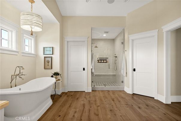 Bathroom, Free Standing Baths, Glass Shower, Interior, Recessed Lighting, Wood Texture Flooring