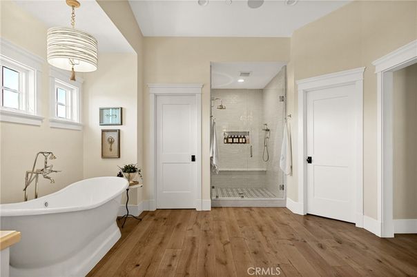 Bathroom, Free Standing Baths, Glass Shower, Interior, Recessed Lighting, Wood Texture Flooring