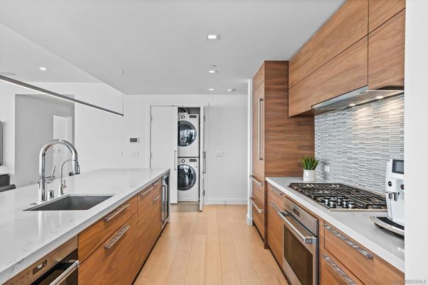 Interior, Kitchen, Recessed Lighting, Stainless Steel Appliances, Washer, Wood Texture Flooring