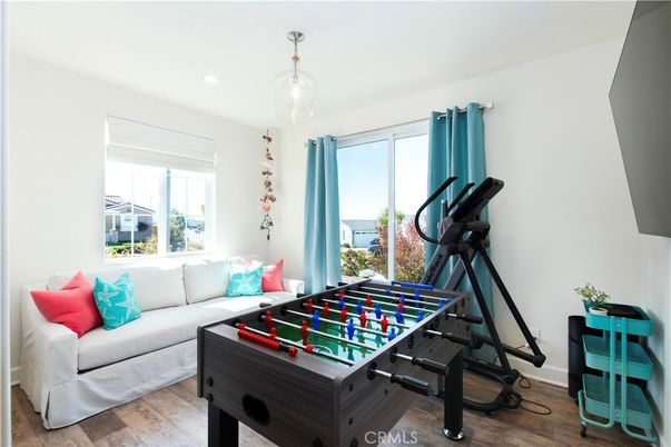 Fitness Equipment, Game Room, Interior, Living room, Recessed Lighting, Wood Texture Flooring