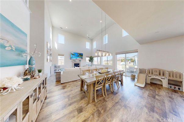 Dining room, Fireplace, Interior, Living room, Pendant Lights, Recessed Lighting, Wood Texture Flooring