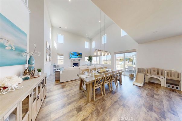 Dining room, Fireplace, Interior, Living room, Pendant Lights, Recessed Lighting, Wood Texture Flooring