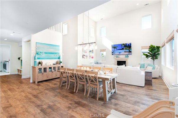 Dining room, Fireplace, Interior, Living room, Pendant Lights, Recessed Lighting, Wood Texture Flooring
