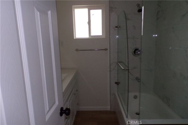 Bathroom, Glass Shower, Interior, Marble Walls, Wood Texture Flooring