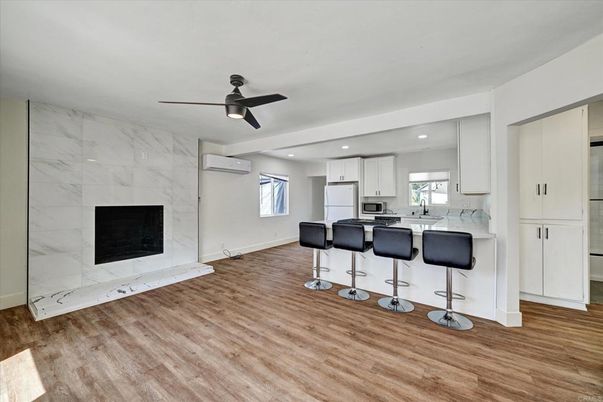 Fireplace, Interior, Kitchen, Marble Walls, Recessed Lighting, Wood Texture Flooring