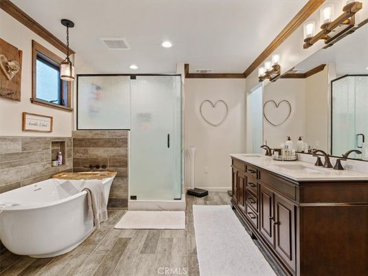 Bathroom, Dual Sink Vanities, Free Standing Baths, Glass Shower, Interior, Pendant Lights, Recessed Lighting, Wood Texture Flooring