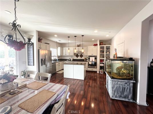 Dining room, Interior, Kitchen, Pendant Lights, Recessed Lighting, Stainless Steel Appliances, Wood Texture Flooring