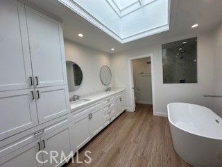Bathroom, Dual Sink Vanities, Free Standing Baths, Interior, Recessed Lighting, Wood Texture Flooring