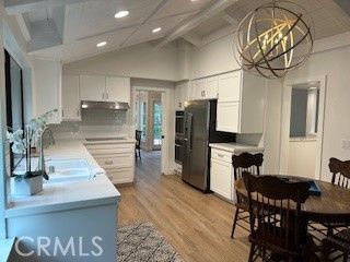 Chandelier, Dining room, Interior, Kitchen, Pendant Lights, Recessed Lighting, Stainless Steel Appliances, Wood Texture Flooring