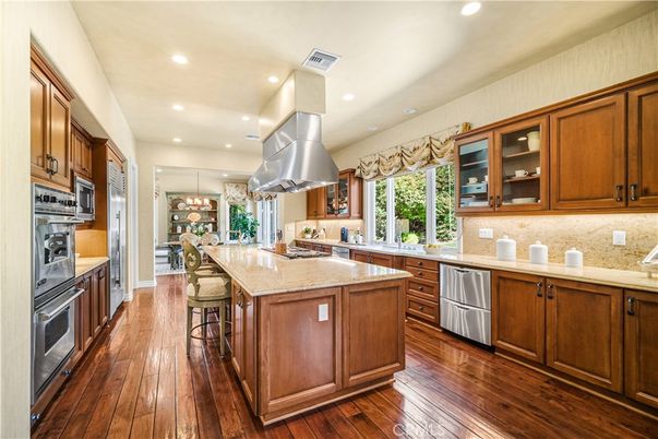 Chandelier, Interior, Kitchen, Pendant Lights, Recessed Lighting, Stainless Steel Appliances, Wood Texture Flooring