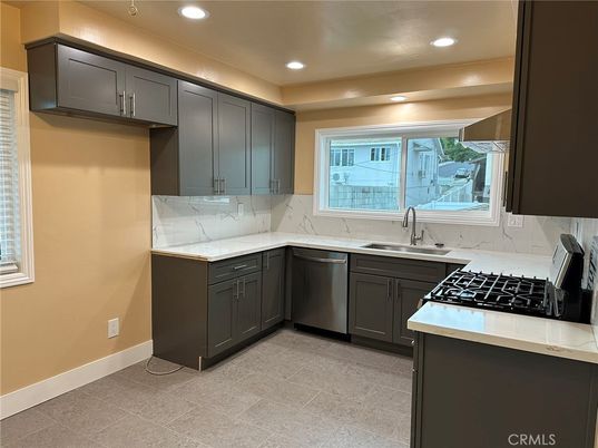 Interior, Kitchen, Marble Walls, Recessed Lighting, Stainless Steel Appliances