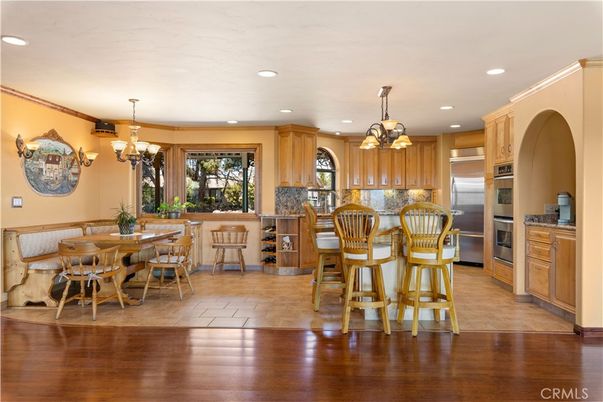 Chandelier, Dining room, Interior, Kitchen, Pendant Lights, Recessed Lighting, Stainless Steel Appliances, Wood Texture Flooring