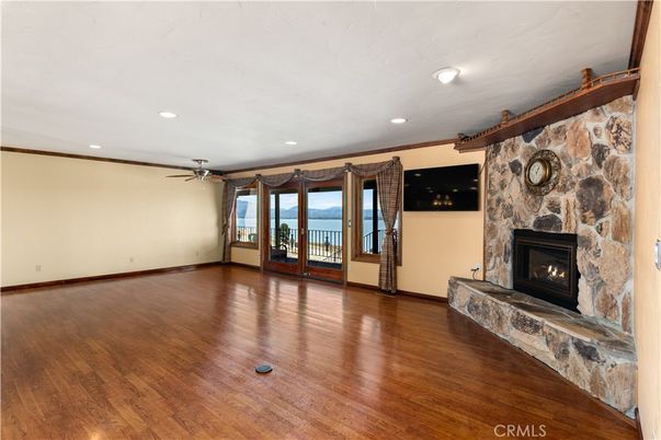 Empty room, Fireplace, Interior, Recessed Lighting, Stone Walls, Wood Texture Flooring