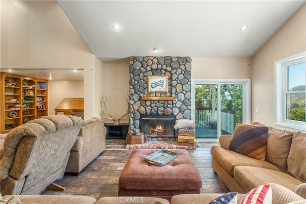 Fireplace, Interior, Living room, Recessed Lighting, Stone Walls, Wood Texture Flooring