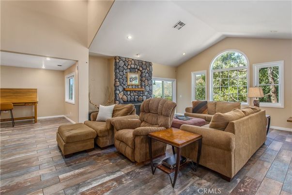 Fireplace, Interior, Living room, Recessed Lighting, Stone Walls, Wood Texture Flooring