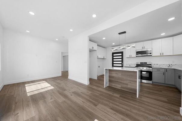 Interior, Kitchen, Pendant Lights, Recessed Lighting, Stainless Steel Appliances, Wood Texture Flooring