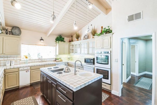 Interior, Kitchen, Pendant Lights, Tile Countertops, Wood Texture Flooring