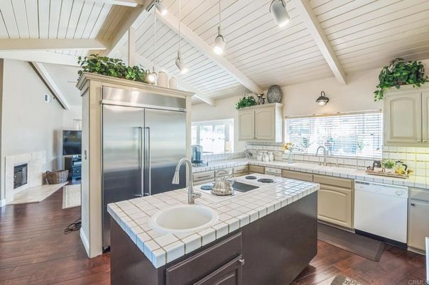 Fireplace, Interior, Kitchen, Stainless Steel Appliances, Tile Countertops, Wood Texture Flooring