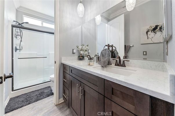 Bathroom, Dual Sink Vanities, Glass Shower, Interior, Wood Texture Flooring