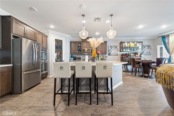 Dining room, Interior, Kitchen, Pendant Lights, Recessed Lighting, Stainless Steel Appliances, Wood Texture Flooring