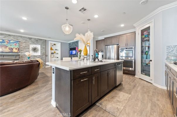 Interior, Kitchen, Living room, Pendant Lights, Recessed Lighting, Stainless Steel Appliances, Stone Walls, Wood Texture Flooring