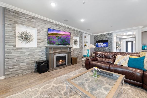Fireplace, Interior, Living room, Recessed Lighting, Stone Walls, Wood Texture Flooring