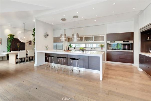 Chandelier, Dining room, Interior, Kitchen, Pendant Lights, Recessed Lighting, Stainless Steel Appliances, Wood Texture Flooring