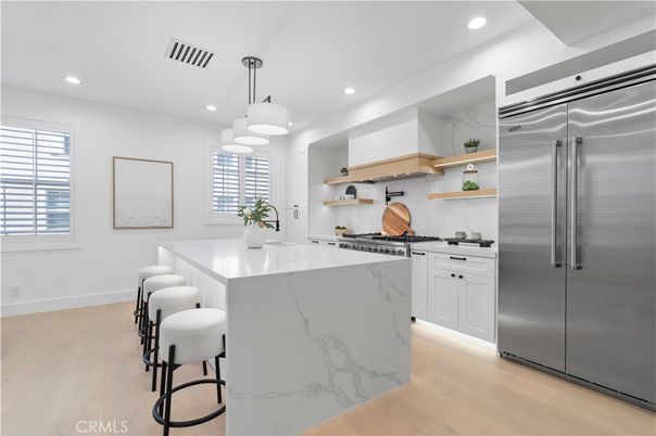 Interior, Kitchen, Marble Walls, Pendant Lights, Recessed Lighting, Stainless Steel Appliances, Wood Texture Flooring