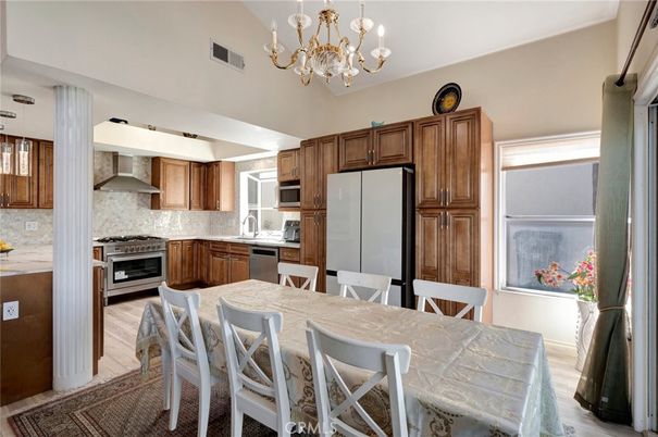 Chandelier, Dining room, Interior, Kitchen, Stainless Steel Appliances, Wood Texture Flooring