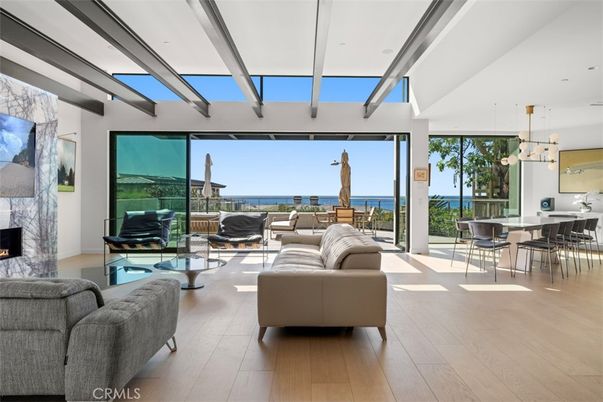 Dining room, Fireplace, Interior, Living room, Pendant Lights, Recessed Lighting, Water, Wood Texture Flooring