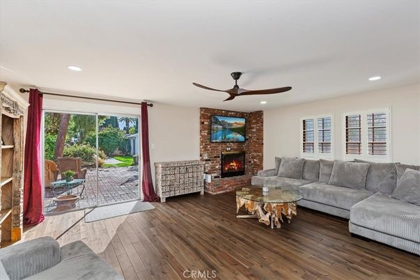 Fireplace, Interior, Living room, Recessed Lighting, Stone Walls, Wood Texture Flooring