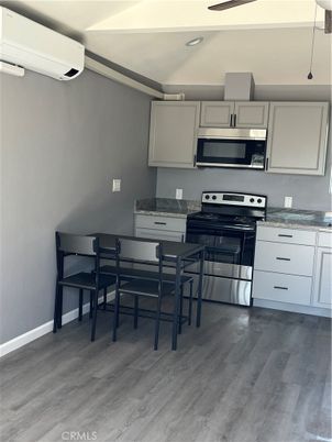 Dining room, Interior, Kitchen, Recessed Lighting, Stainless Steel Appliances, Wood Texture Flooring