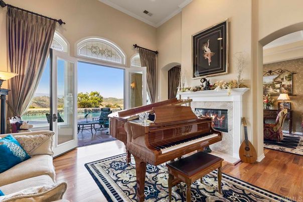 Fireplace, Interior, Living room, Piano, Recessed Lighting, Wood Texture Flooring